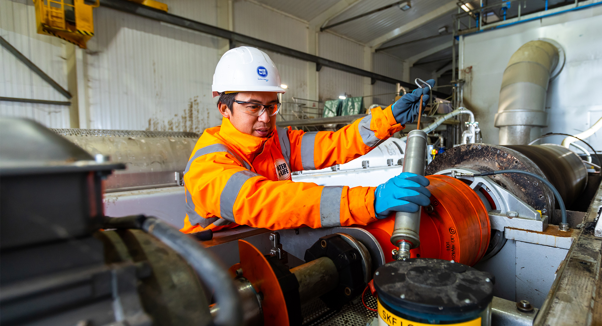 A Southern Water engineer works inside a wastewater treatment works