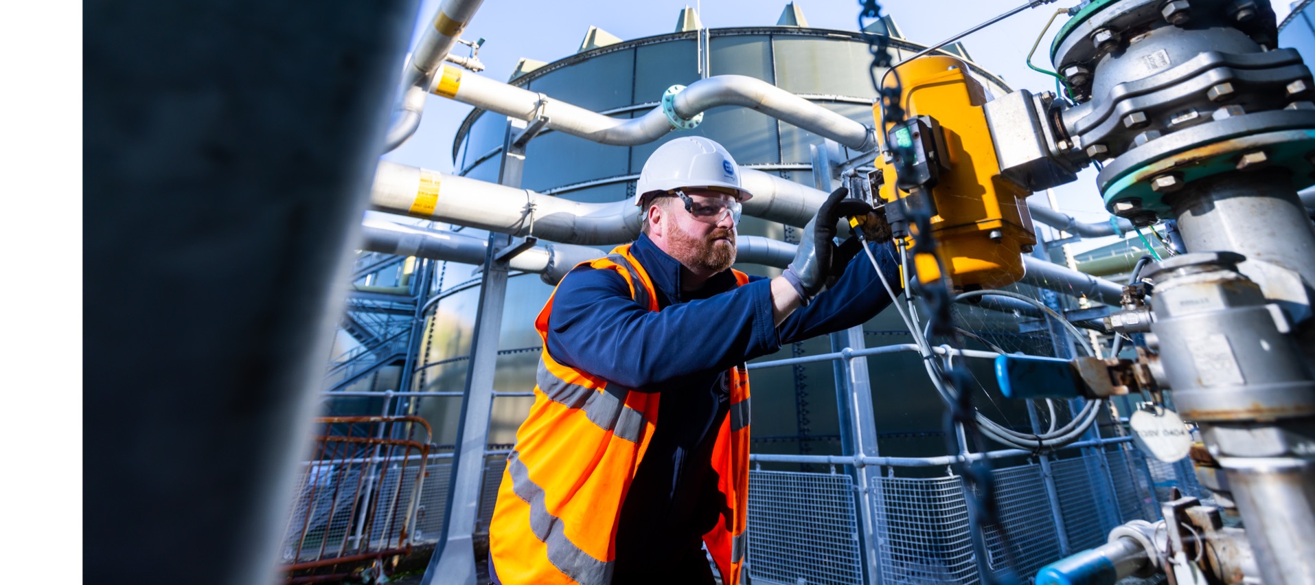 Engineer checking readings on pipes