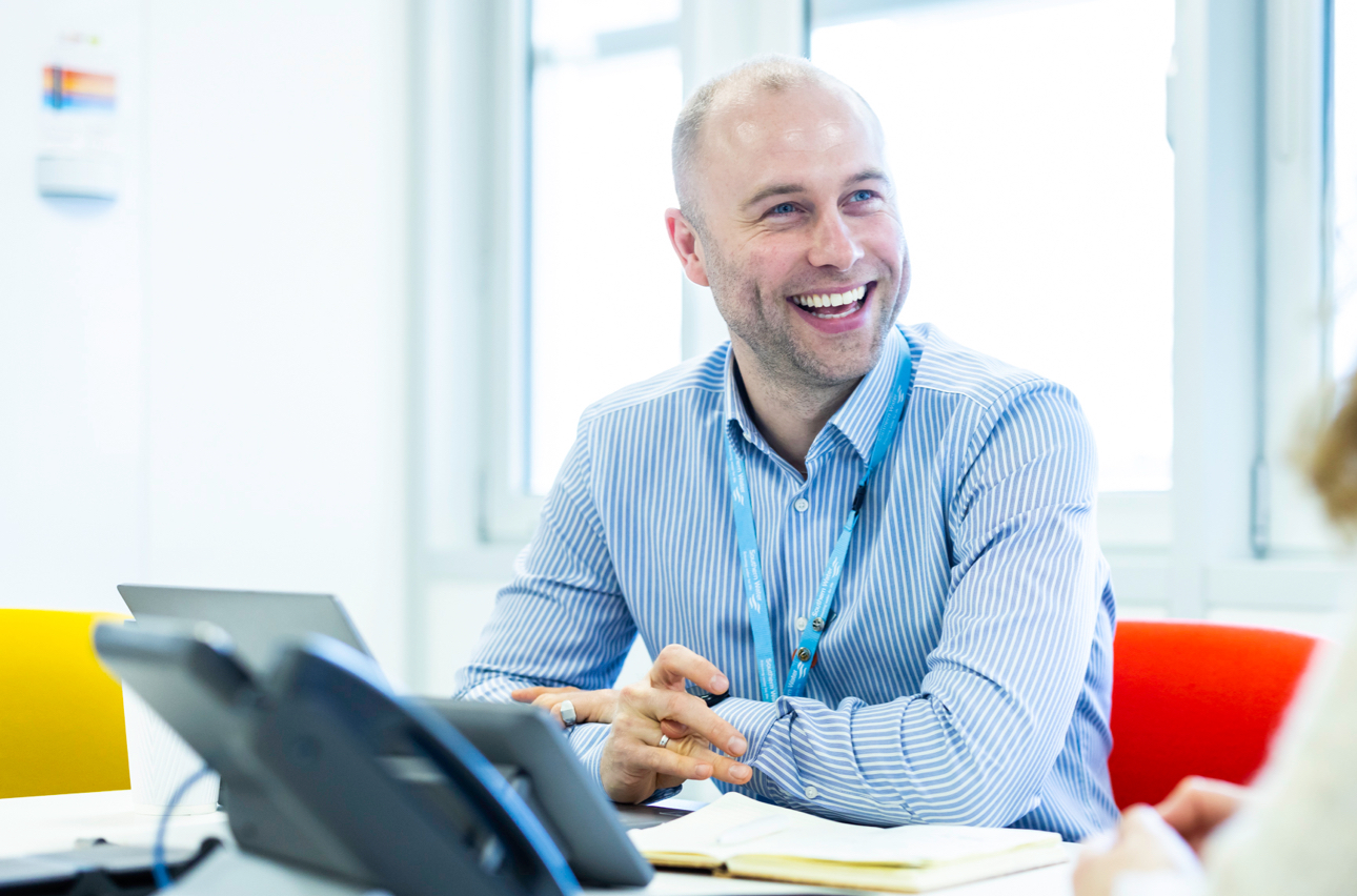 Office worker smiling while working